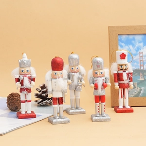 Detailed view of five 12cm wooden nutcracker soldiers with red and silver glitter finish