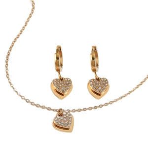 Golden stainless steel heart jewelry set with necklace and zircon earrings on white background