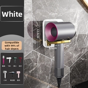 White wall-mounted hair dryer holder with golden L-bracket on dark marble background