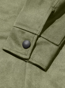 Detailed macro shot of army green suede cuff with matte black snap button and stitching
