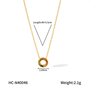 Close-up of 18K gold stainless steel necklace featuring a colorful zircon pendant