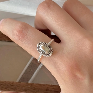 Vintage 925 sterling silver oval ring with bohemian rope texture on model hand