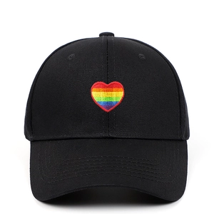 Classic black twill cotton baseball cap featuring rainbow heart embroidery on front