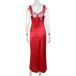 Close-up of red satin dress back with lace trim and elegant lace-up details