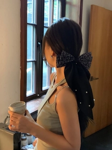 Floral print bow hair clip with white pearls on elegant long black ribbon streamers
