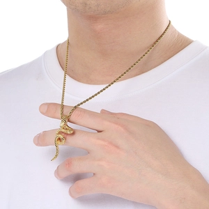 Close-up of a 18k gold plated snake pendant with scale details on a twisted rope chain