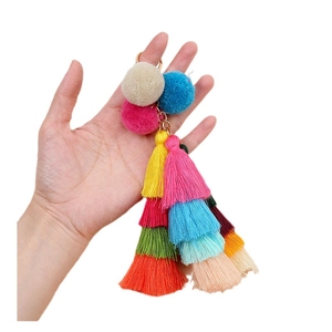 Colorful pom pom tassel keychain featuring layered yarn fringes and golden ring clasp