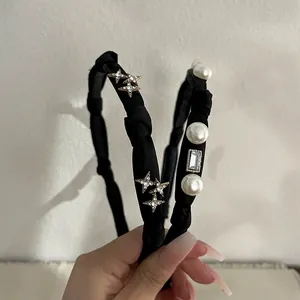 Elegant black fabric headbands with pearls, crystals, and star patterns for women