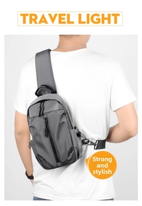 Detail of dark grey water-resistant nylon chest bag with multiple zipper pockets