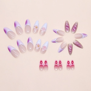 Detail of 3D ice-textured gradient press-on nails with pearls and striped French patterns
