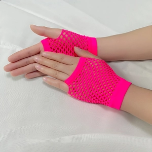 Detail view of neon pink short fishnet fingerless gloves with elastic mesh texture