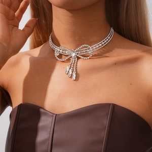 Elegant silver choker with bowknot design featuring faux pearls and crystal tassels
