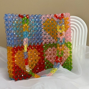 Detailed close-up of colorful handmade acrylic beaded tote bag with multi-color blocks