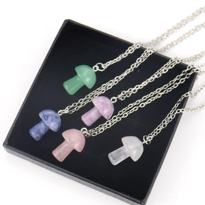 Five colorful natural stone mushroom pendant necklaces with silver chains in a gift box