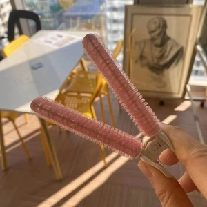 Pink hair root volumizing clip for bangs and crown styling with velcro texture