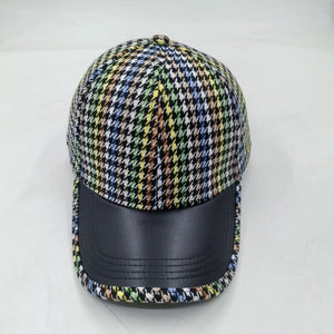 Colorful houndstooth baseball cap with black leather brim and mixed weave fabric crown