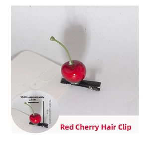 Detailed view of realistic red cherry hair clip with dimensions and black metal grip