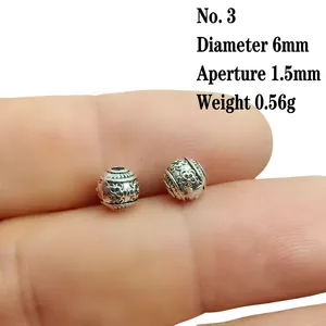Macro shot of 6mm vintage silver engraved spacer bead for DIY jewelry making