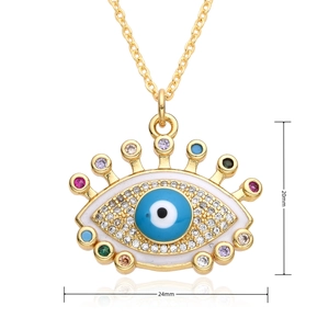 Detail shot of multi-color zircon evil eye pendant in gold with 24mm by 20mm dimensions