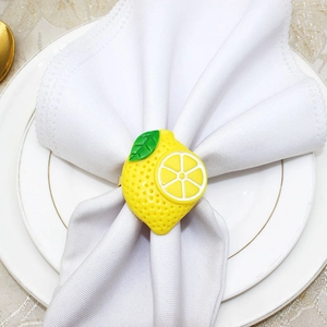 Detailed top view of lemon napkin ring on a white plate for summer table setting