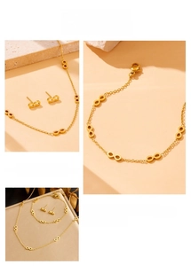 Detailed view of infinity symbol gold jewelry set including necklace, bracelet and earrings