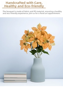 Close-up of golden silk artificial Poinsettia bouquet in a matte blue ceramic vase