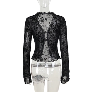 Detail of black chiffon lace top with sheer floral texture and ruffled flared sleeves