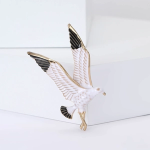 Elegant seagull enamel brooch in white and gold finish for women's blazer