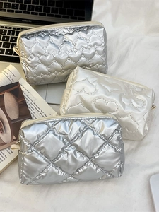 Quilted heart and diamond pattern makeup bags in silver and cream metallic finish