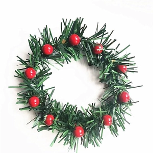 Christmas napkin ring with green pine needles and red berries for festive table decor