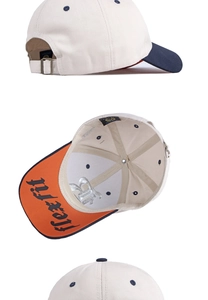 Detail of adjustable metal buckle and contrast color visor on cotton baseball cap