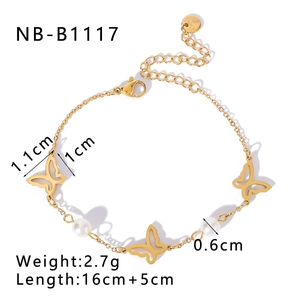 Detail of gold butterfly bracelet with pearls showing S. Steel hallmark and size specs