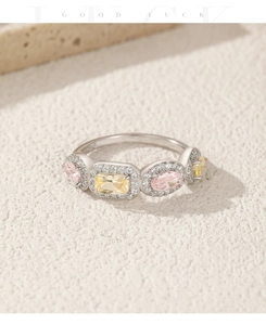 Detail of S925 sterling silver ring with colorful gems and halo-set zircon stones