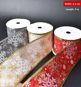 Macro view of 6.3cm wide Christmas snowflake ribbon with metallic gold wire edges