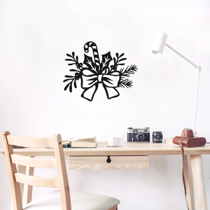 Detail of black Christmas wall decals with candy canes and bows in a modern home office