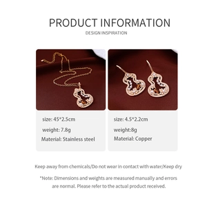 Detail view of tiger eye stone and pearl gourd jewelry set with hollow floral patterns