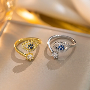 Adjustable evil eye ring in gold and silver finish with blue crystal and cubic zirconia