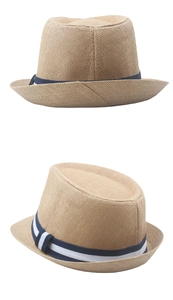 Detail of breathable khaki straw fedora showing woven texture and blue striped band