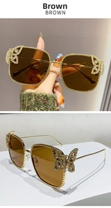 Detail of golden square sunglasses with butterfly rhinestone decoration and brown lenses