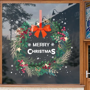 Christmas wreath window sticker with red bow berries and Merry Christmas text decor