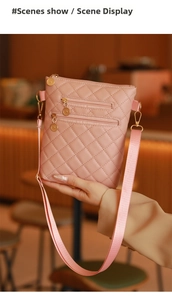 Detailed view of pink quilted crossbody bag with multi-zipper layers and woven strap