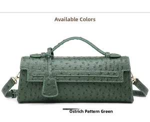 Close-up of green ostrich embossed leather on the elegant baguette shoulder handbag