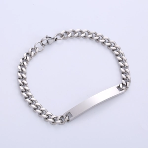Close-up of a silver stainless steel cuban chain bracelet with a blank rectangular bar
