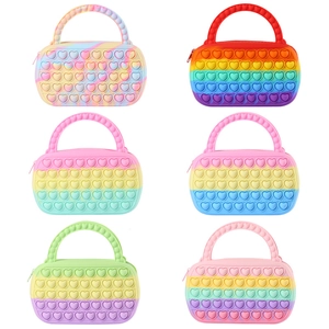 Silicone heart pop-it fidget tote bags in multiple rainbow colors for sensory stress relief
