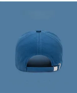 Detail of adjustable metal buckle on navy cotton baseball cap with multi-color options