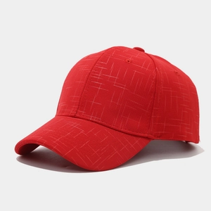 Close-up of red baseball cap showing detailed mesh texture and classic six-panel design