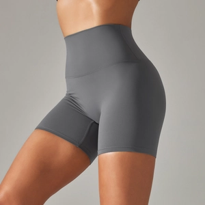 Close-up of high-waist grey yoga shorts showing stretch fabric and body-shaping fit