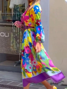 Elegant floral long sleeve maxi dress with purple belt and vibrant chiffon print