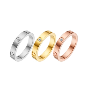 Polished titanium steel heart rings in silver, gold, and rose gold with diamond accents