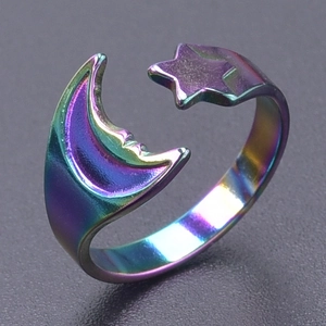 Detail of adjustable rainbow stainless steel ring featuring celestial moon and star design